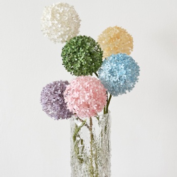 Artificial flowers with green onion balls